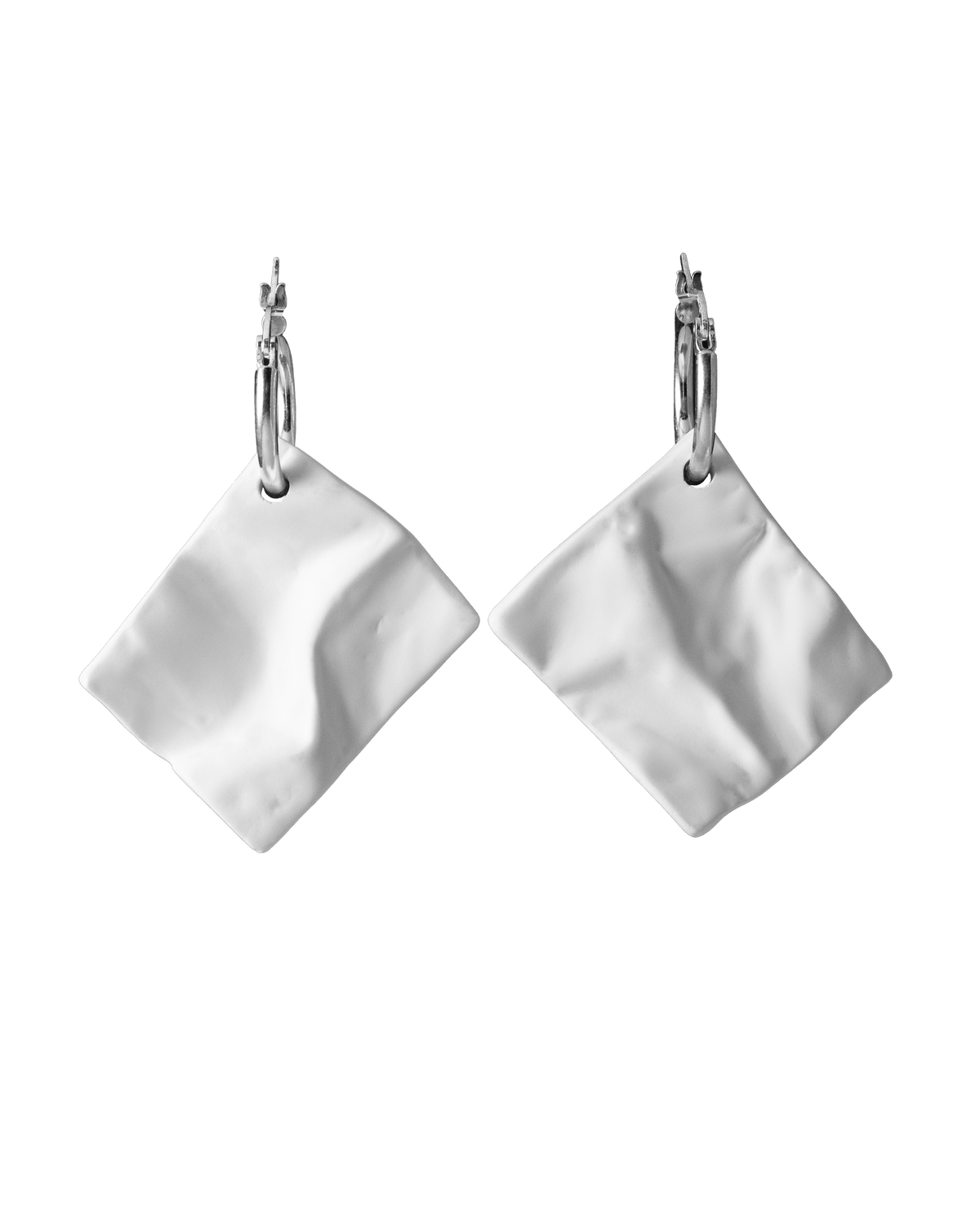 Pair of white ceramic crinkle-texture drop earrings on sterling silver hoops, handcrafted by Reika Studio.