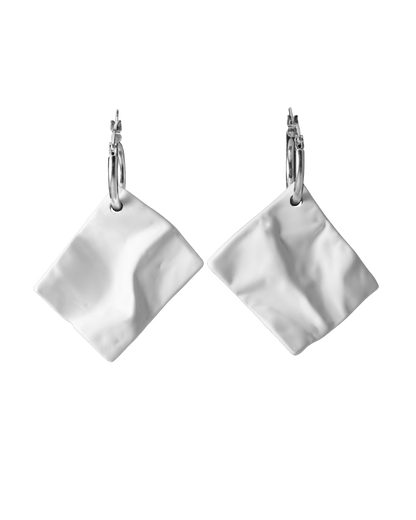 Pair of white ceramic crinkle-texture drop earrings on sterling silver hoops, handcrafted by Reika Studio.