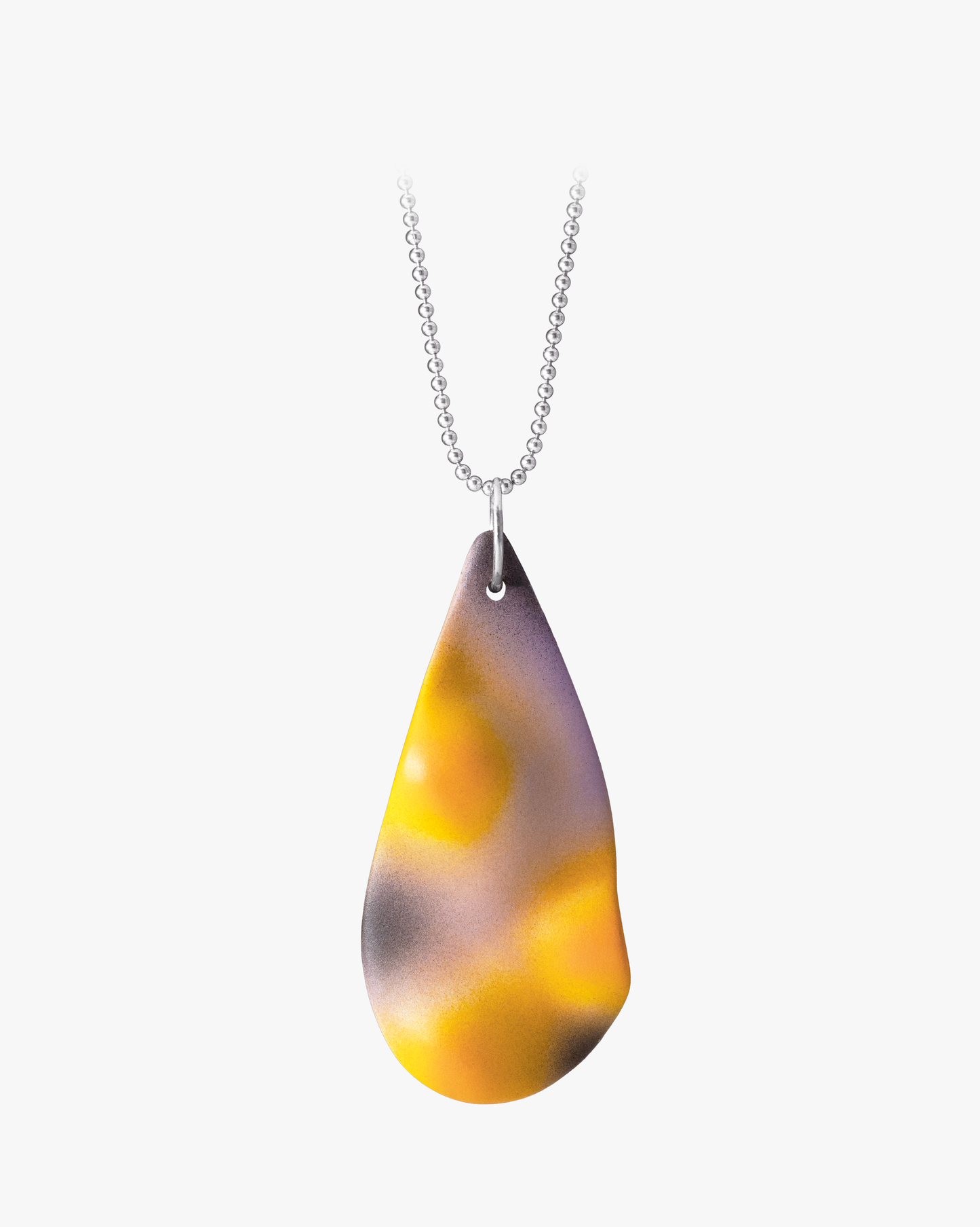 Hand-cast ceramic TOPO Teardrop necklace in Eclipse, featuring a topographic surface with a soft pink and yellow gradient and bold black shadows suspended on a silver ball chain.