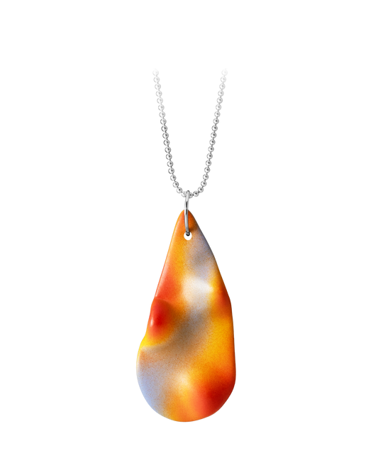 Close-up of a hand-cast ceramic Topo Teardrop pendant in Frequency, featuring a topographic surface with a vibrant airbrushed gradient of lilac, solar yellow, and tangerine on a sterling silver ball chain.